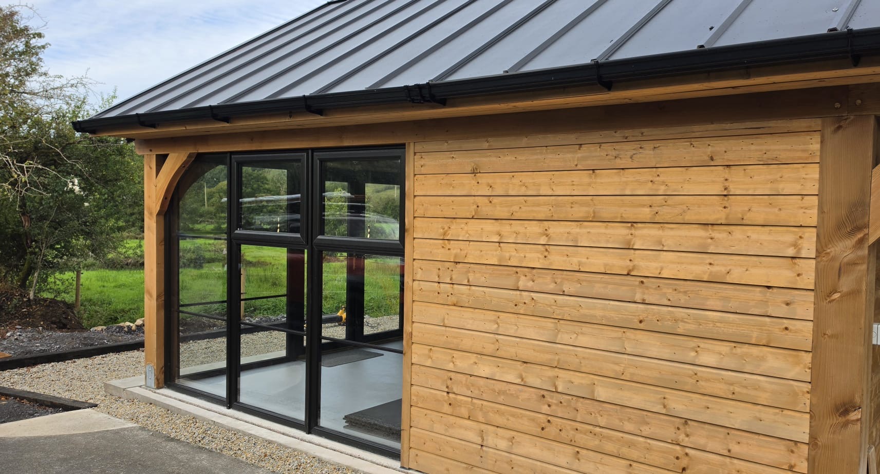 Black-framed windows in a timber-framed building